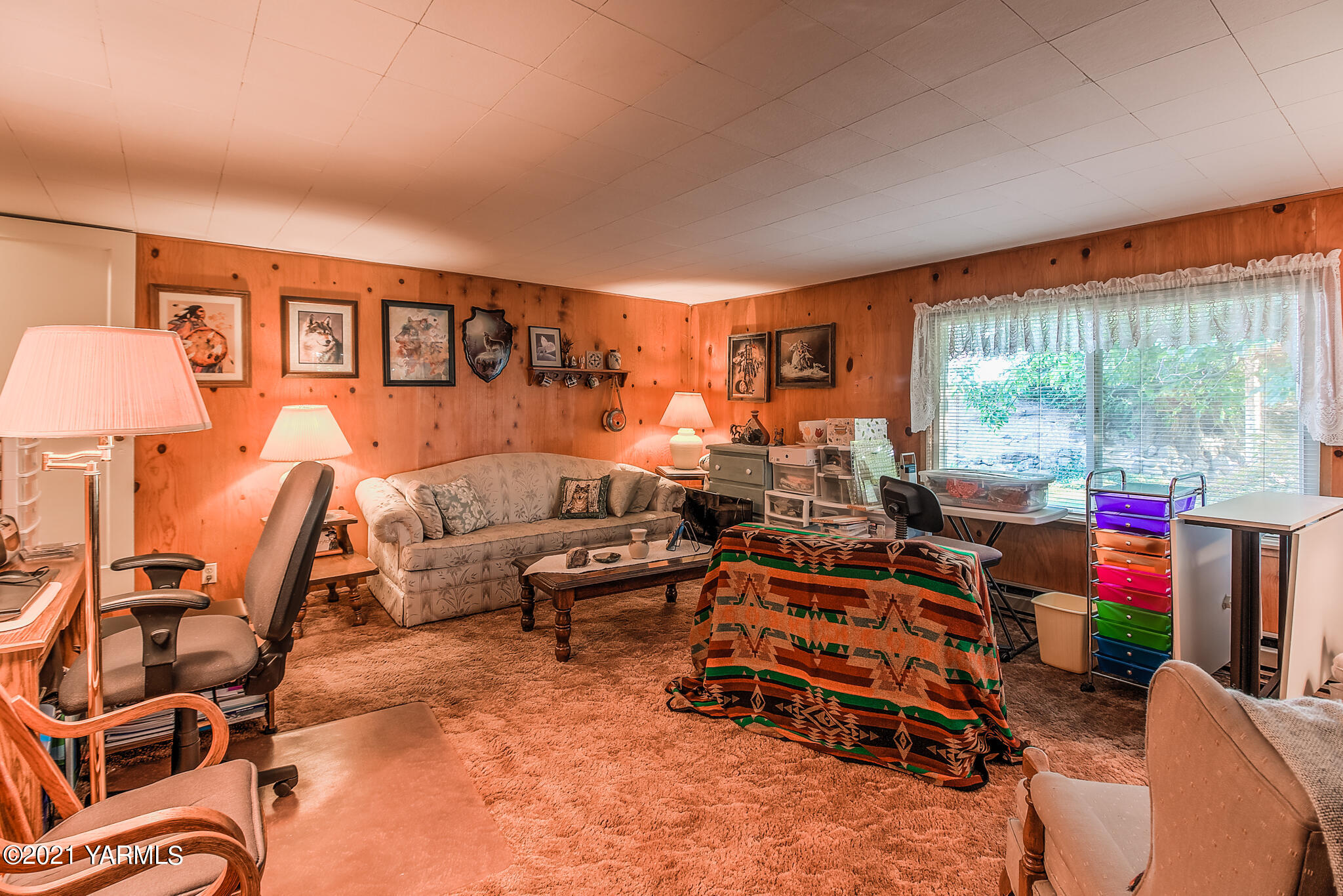 681 Lateral A Road Wapato, WA 98951 - Photo 14 of 19 a living room with furniture a flat screen tv and a large window