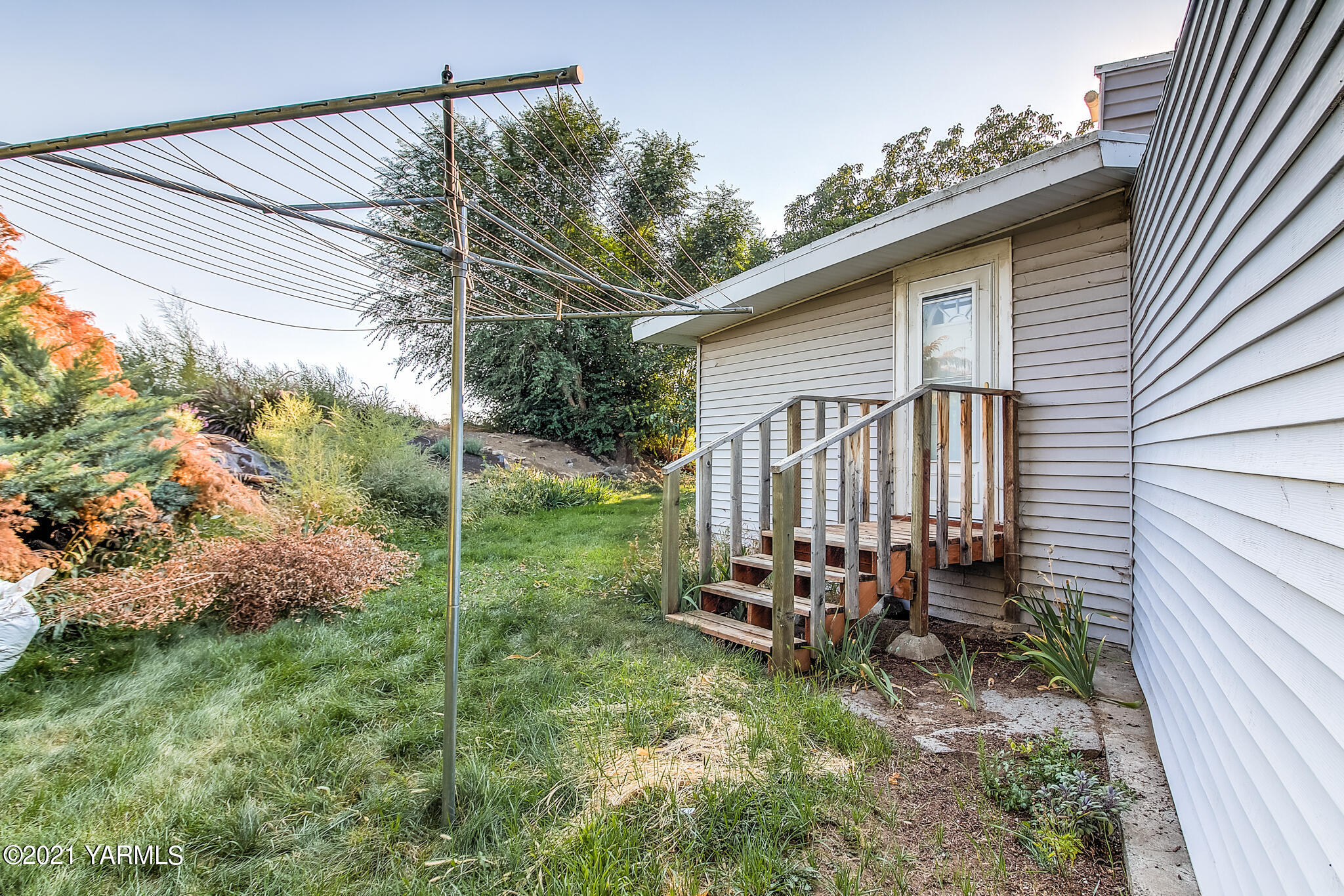 681 Lateral A Road Wapato, WA 98951 - Photo 15 of 19 a view of backyard with plants and outdoor seating