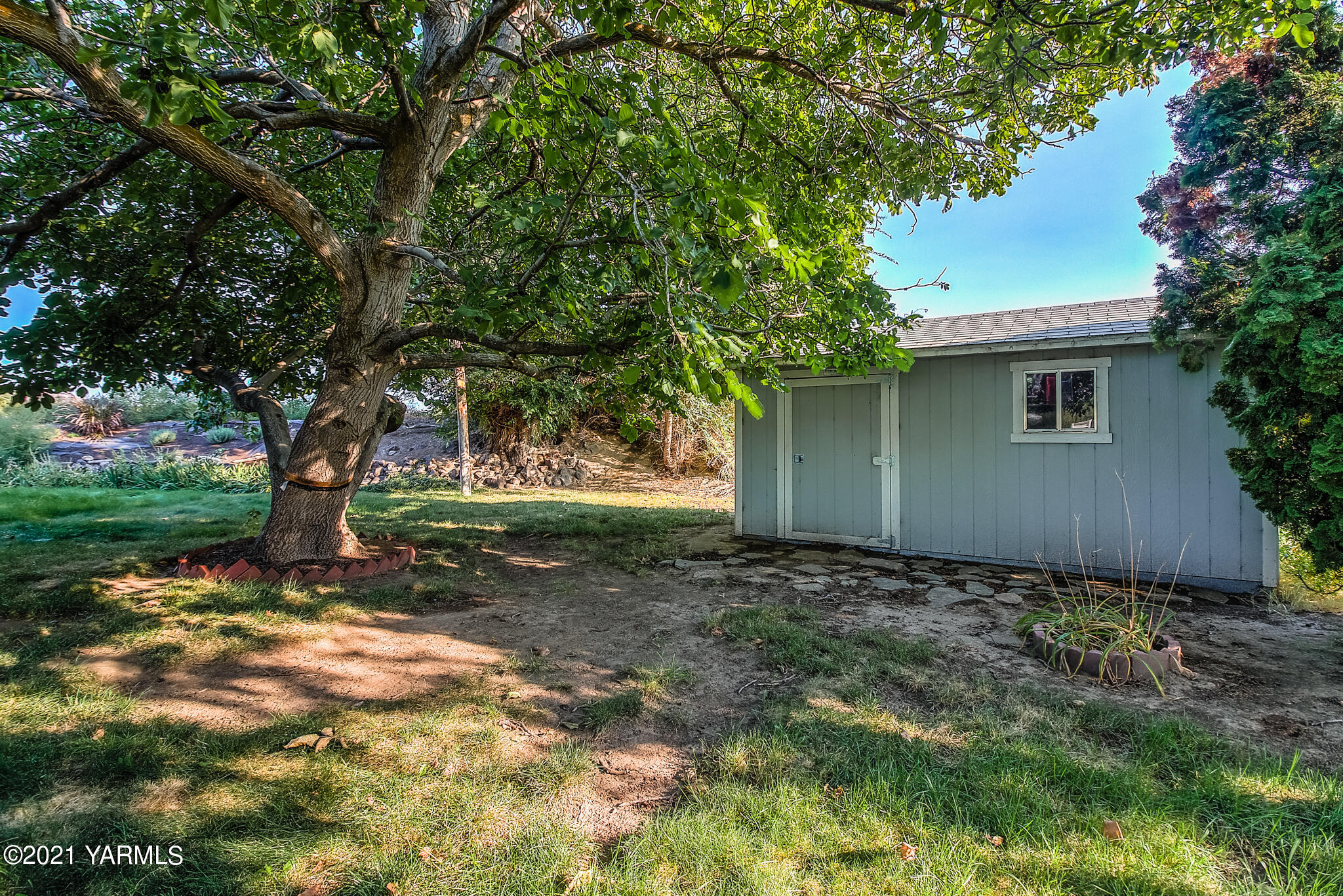 681 Lateral A Road Wapato, WA 98951 - Photo 17 of 19 a view of a house with yard and tree s