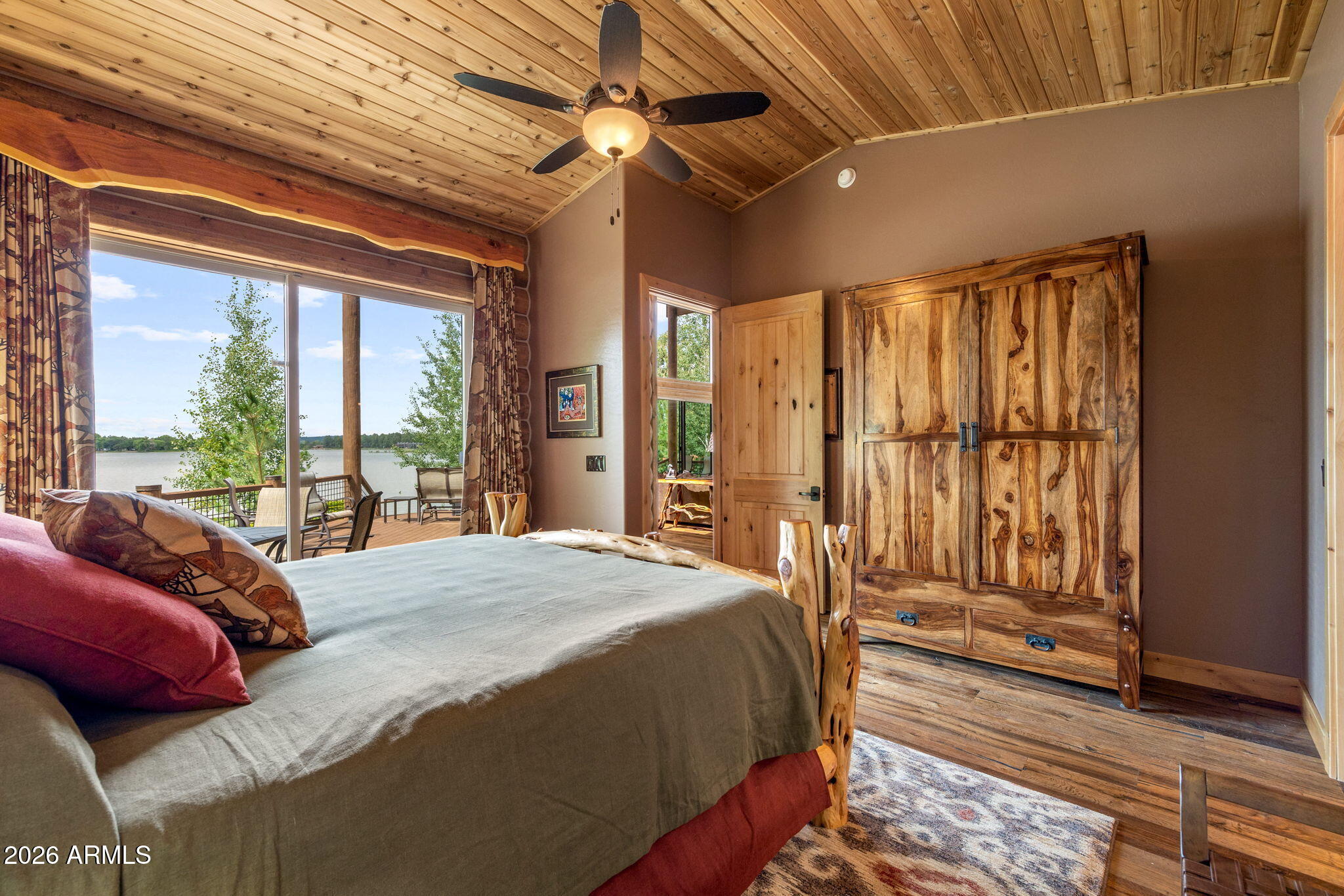 758 Southlake Road Lakeside, AZ 85929 - Photo 24 of 95 a bedroom with a large bed and a large window