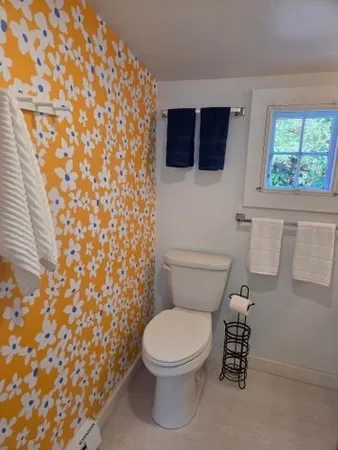 a bathroom with a glass shower door