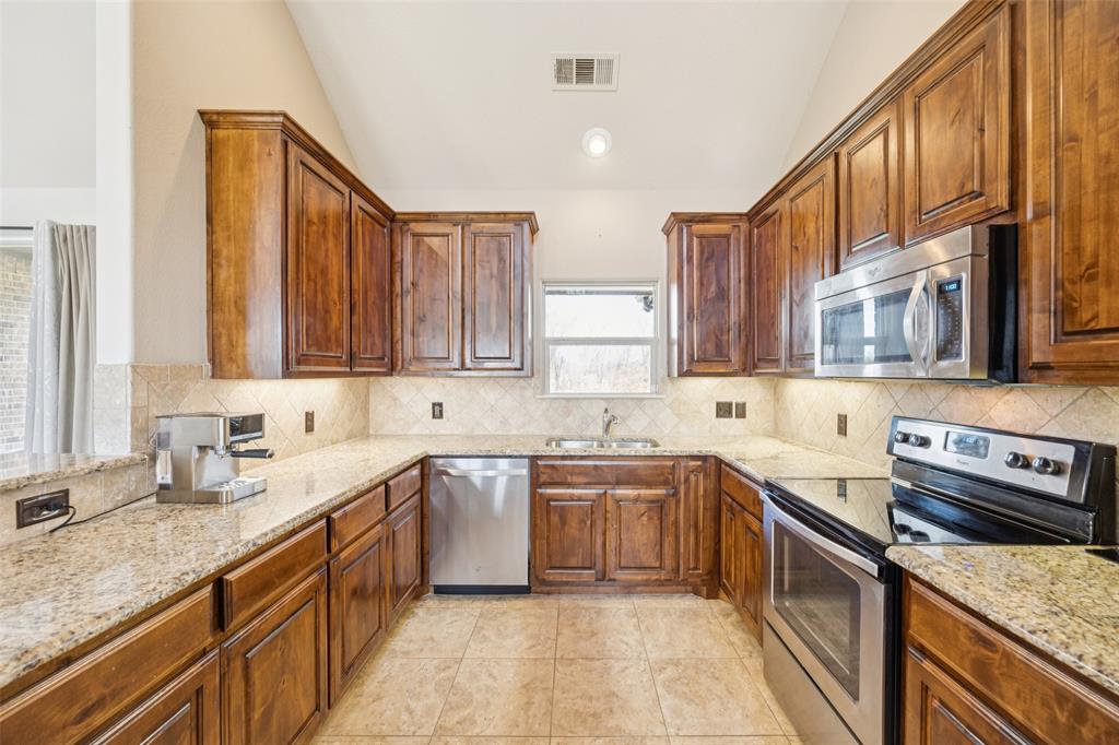 370 Private Road 5291 Yantis, TX 75497 - Photo 11 of 40 a kitchen with a sink stove and cabinets