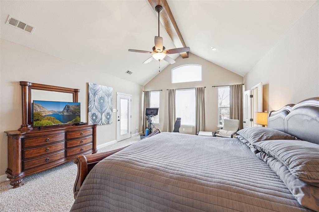 370 Private Road 5291 Yantis, TX 75497 - Photo 15 of 40 a bedroom with a bed and a flat screen tv