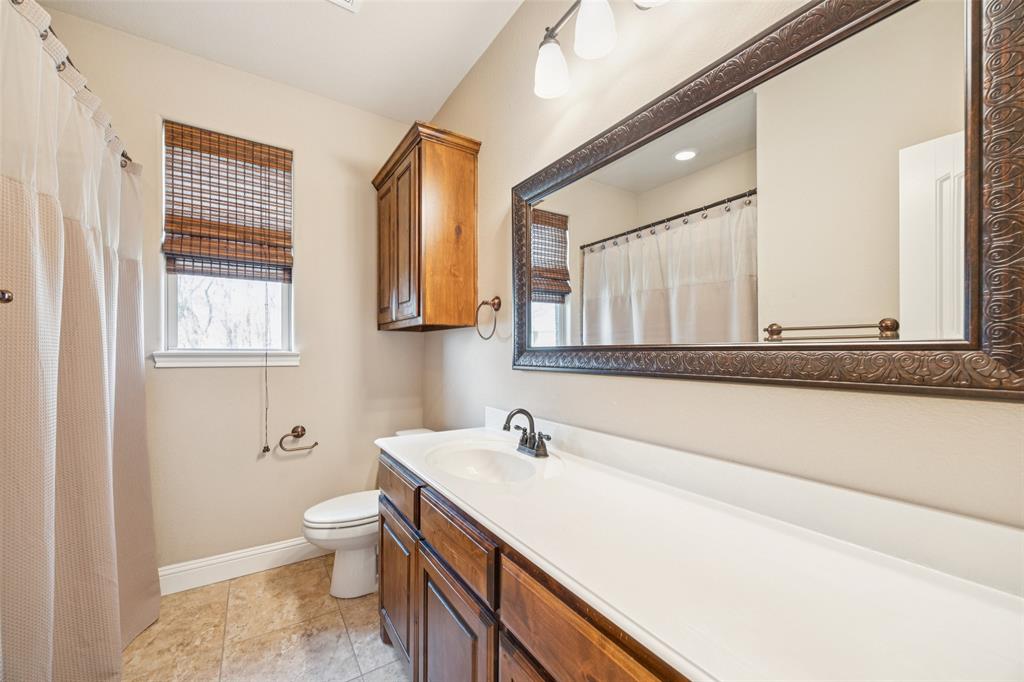 370 Private Road 5291 Yantis, TX 75497 - Photo 20 of 40 a bathroom with a sink a toilet and a mirror