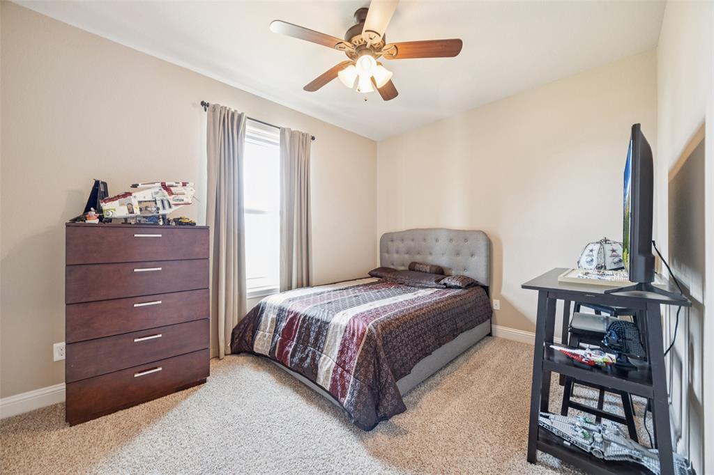 370 Private Road 5291 Yantis, TX 75497 - Photo 21 of 40 a bedroom with a bed and a dresser