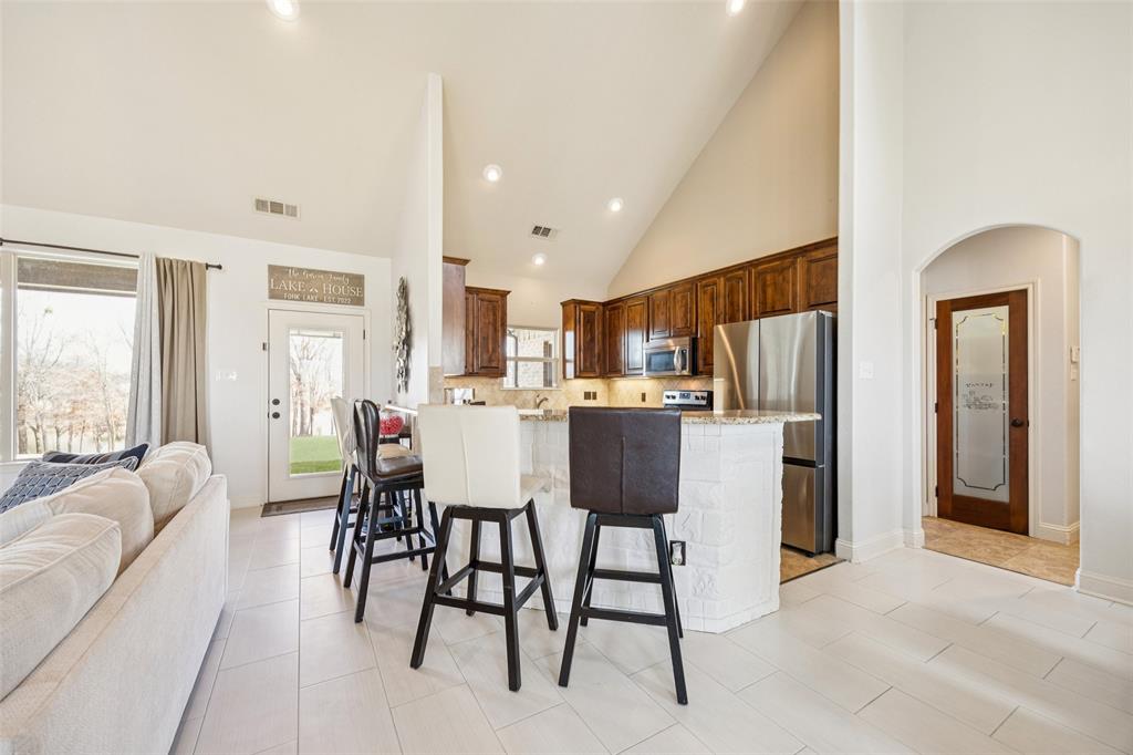370 Private Road 5291 Yantis, TX 75497 - Photo 6 of 40 a living room with stainless steel appliances kitchen island granite countertop furniture and a refrigerator