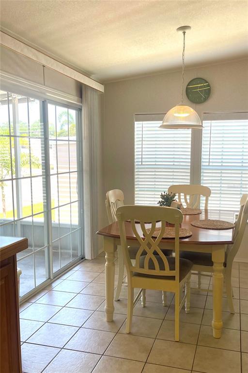 11200 Walsingham Road, Unit 139 Largo, FL 33778 - Photo 11 of 13 a dining room with furniture and window