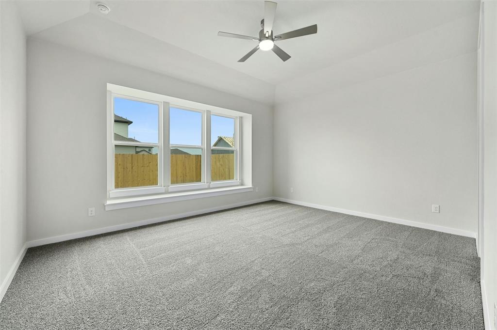 4304 Contrail Lane Round Rock, TX 78665 - Photo 10 of 13 an empty room with a window and kitchen view
