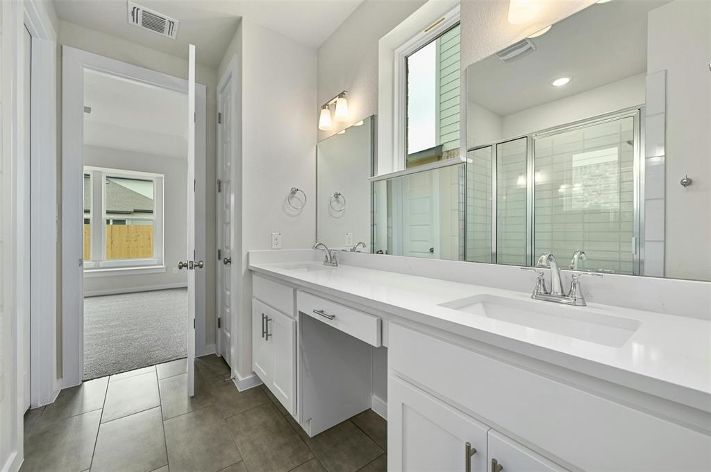 4304 Contrail Lane Round Rock, TX 78665 - Photo 11 of 13 a bathroom with a sink and a mirror
