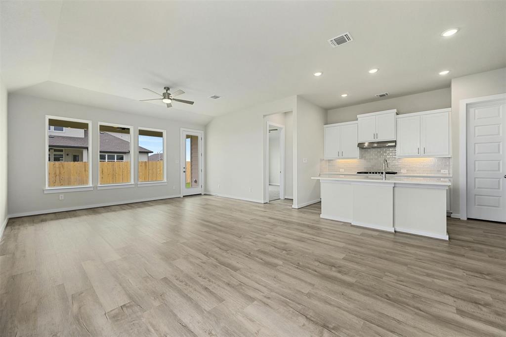4304 Contrail Lane Round Rock, TX 78665 - Photo 13 of 13 a view of an empty room with window and wooden floor