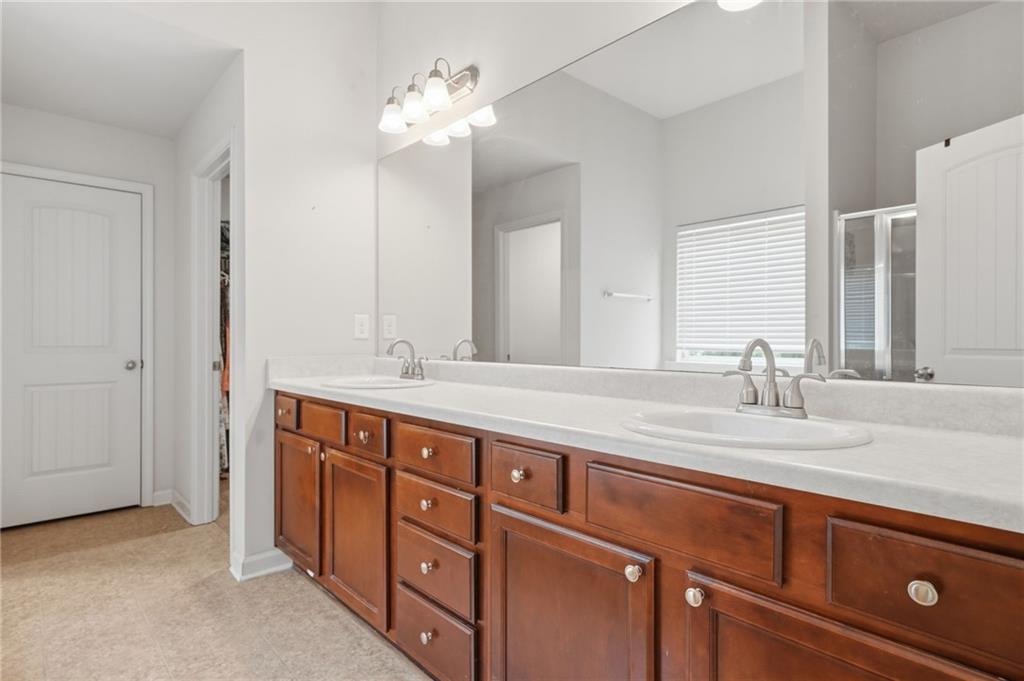 123 Renford Road Ball Ground, GA 30107 - Photo 15 of 27 a spacious bathroom with double sink and a mirror