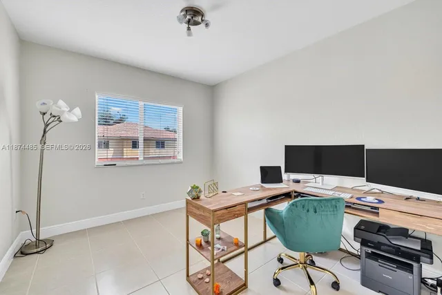 a view of a workspace with furniture