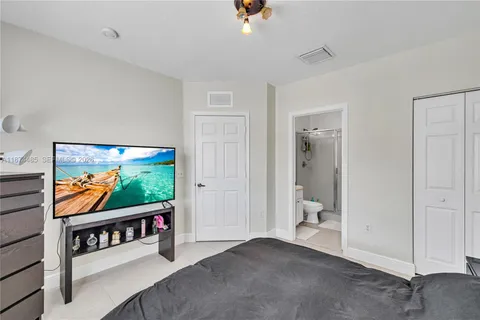 a living room with flat screen tv