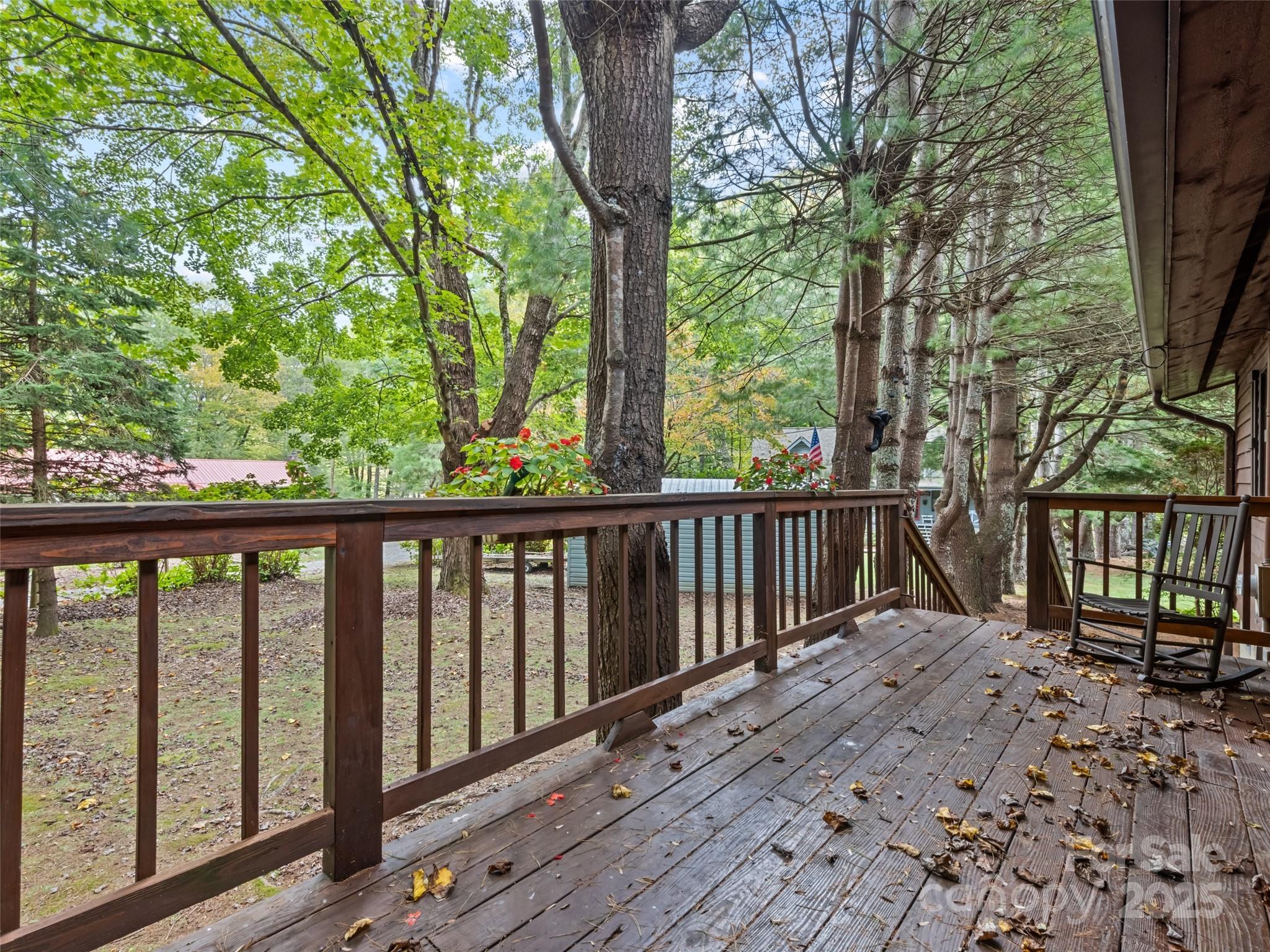 182 Laurel Branch Road Maggie Valley, NC 28751 - Photo 13 of 48 a balcony with wooden floor and fence