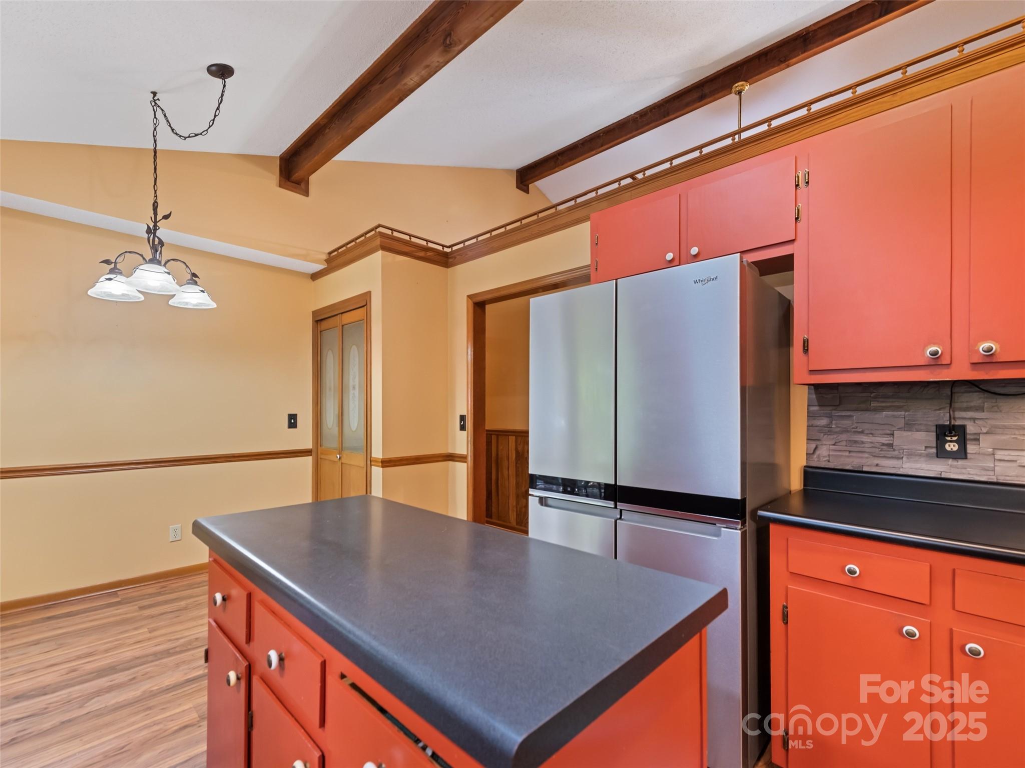 182 Laurel Branch Road Maggie Valley, NC 28751 - Photo 28 of 48 a kitchen with stainless steel appliances granite countertop a sink and a refrigerator