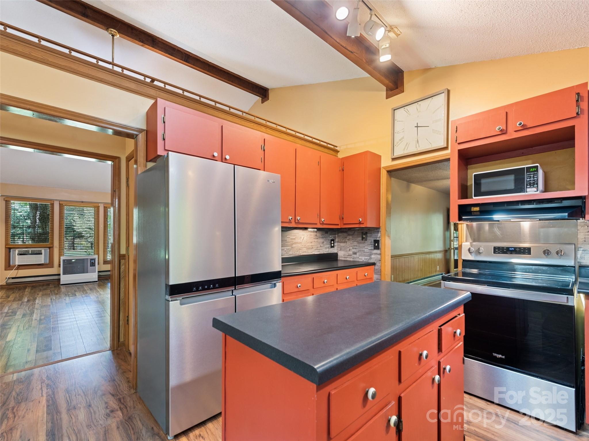 182 Laurel Branch Road Maggie Valley, NC 28751 - Photo 30 of 48 a kitchen with stainless steel appliances a sink stove and refrigerator