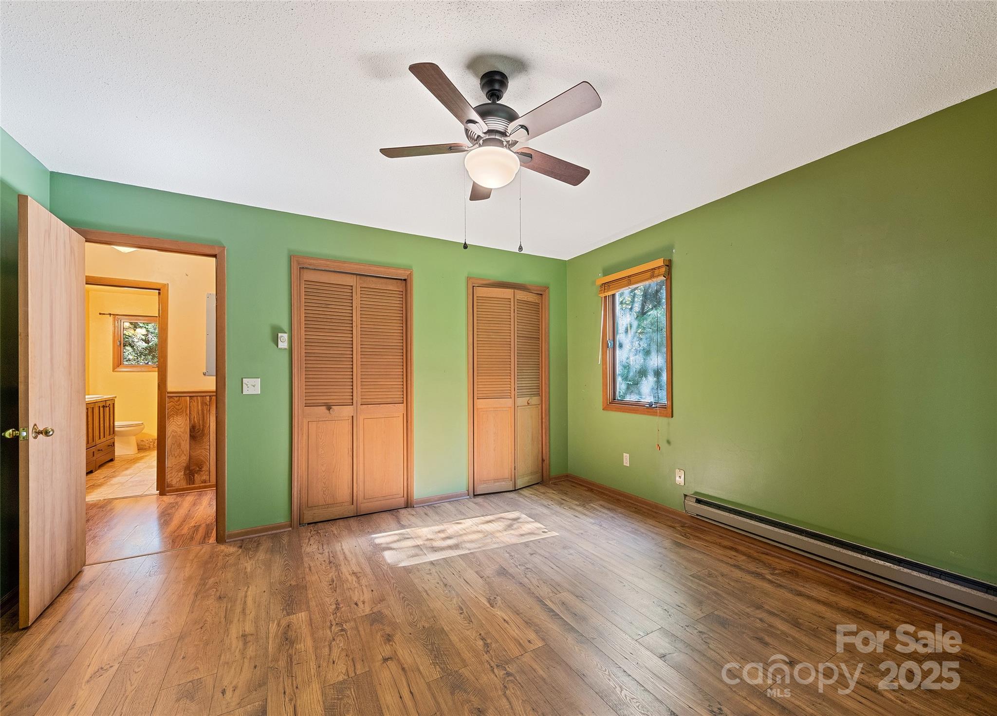 182 Laurel Branch Road Maggie Valley, NC 28751 - Photo 39 of 48 a view of livingroom with hardwood floor and ceiling fan