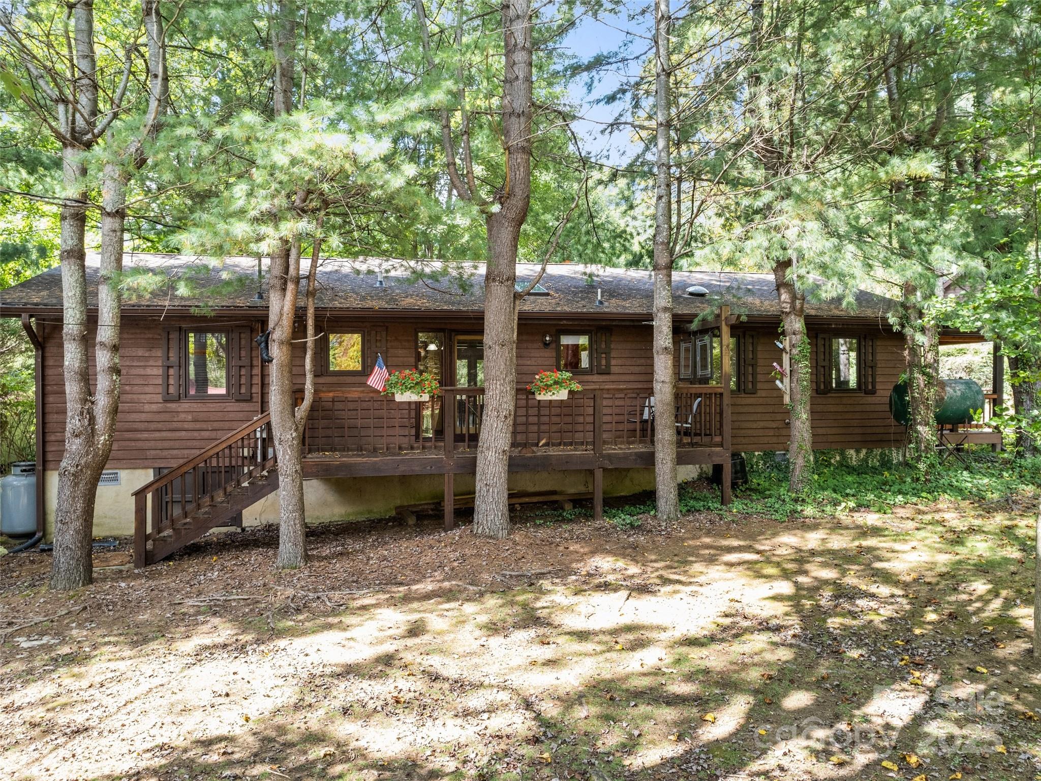 182 Laurel Branch Road Maggie Valley, NC 28751 - Photo 5 of 48 a view of a house with a yard