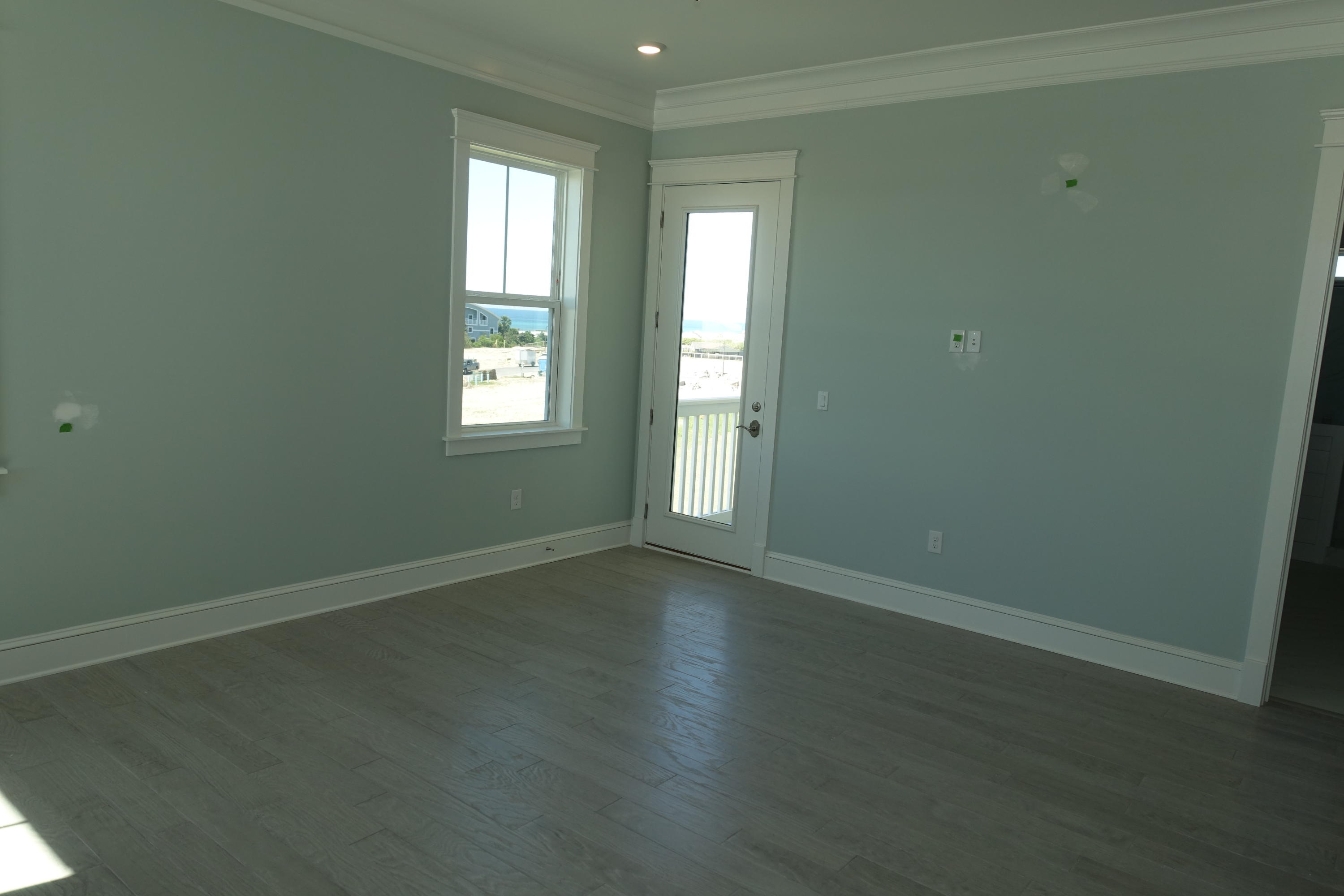 161 Siasconset Ln Inlet Beach Inlet Beach, FL 32461 - Photo 39 of 55 an empty room with wooden floor and windows