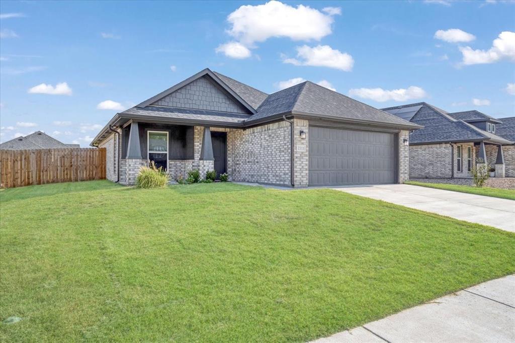 2111 Wyldewood Way Sherman, TX 75092 - Photo 1 of 33 a front view of a house with yard and green space