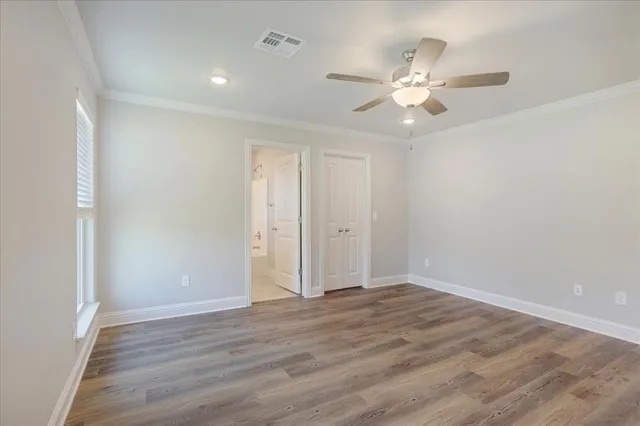 a bathroom with a bathtub and a toilet