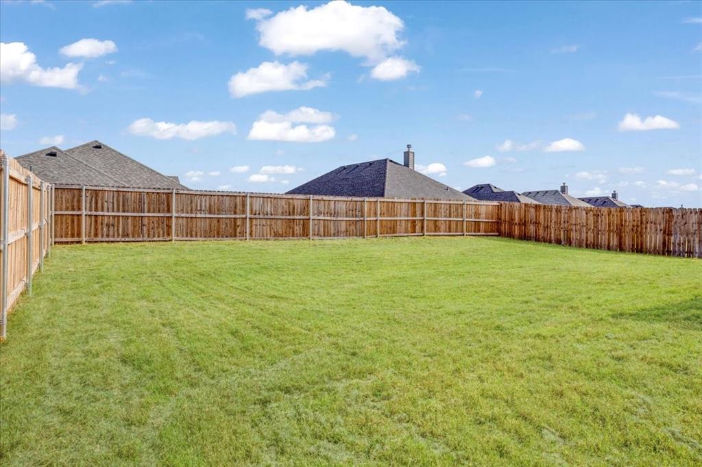 2111 Wyldewood Way Sherman, TX 75092 - Photo 27 of 33 a view of a backyard of a house