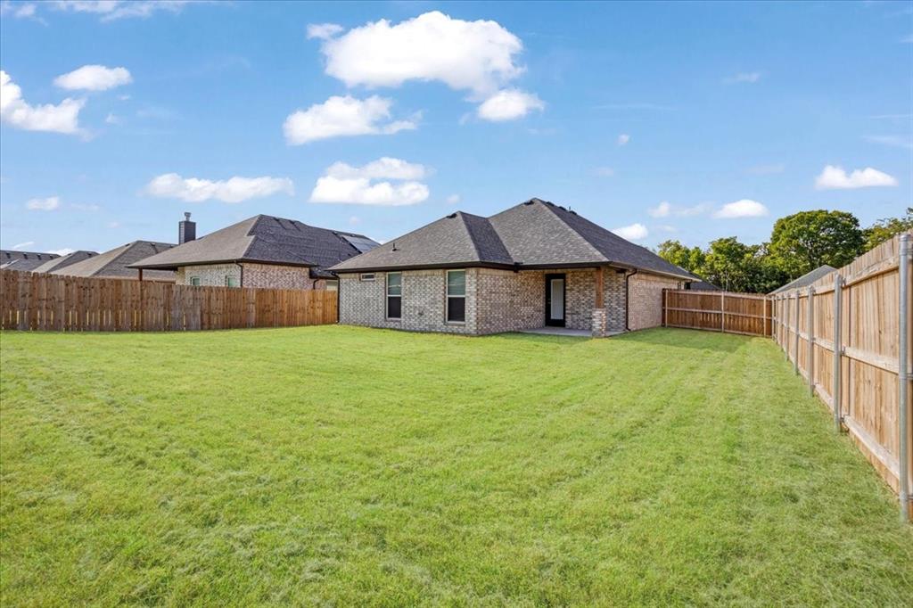 2111 Wyldewood Way Sherman, TX 75092 - Photo 28 of 33 a view of a house with a yard
