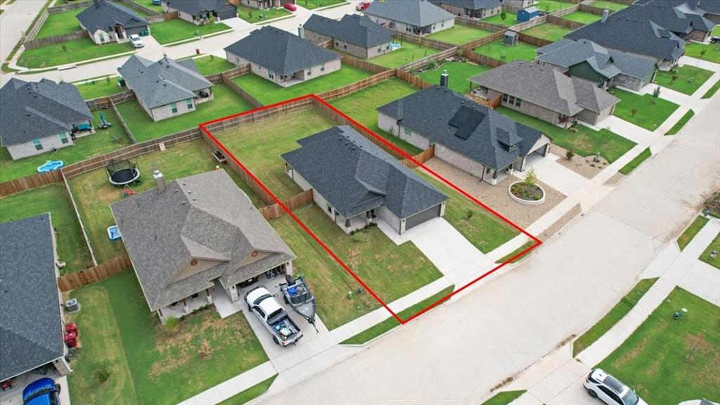 2111 Wyldewood Way Sherman, TX 75092 - Photo 33 of 33 an aerial view of a house with a yard