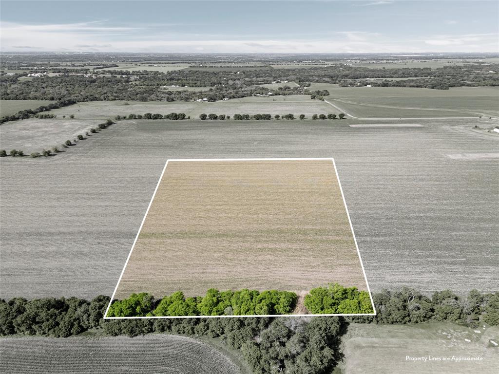 a view of a terrace with lawn chairs