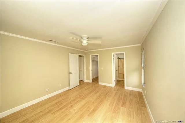 a view of hallway with wooden floor