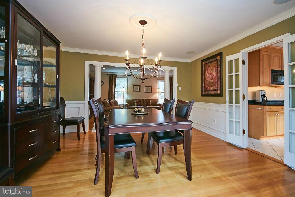 2840 Rifle Ridge Road Oakton, VA 22124 - Photo 14 of 30 a view of a dining room with furniture window and wooden floor