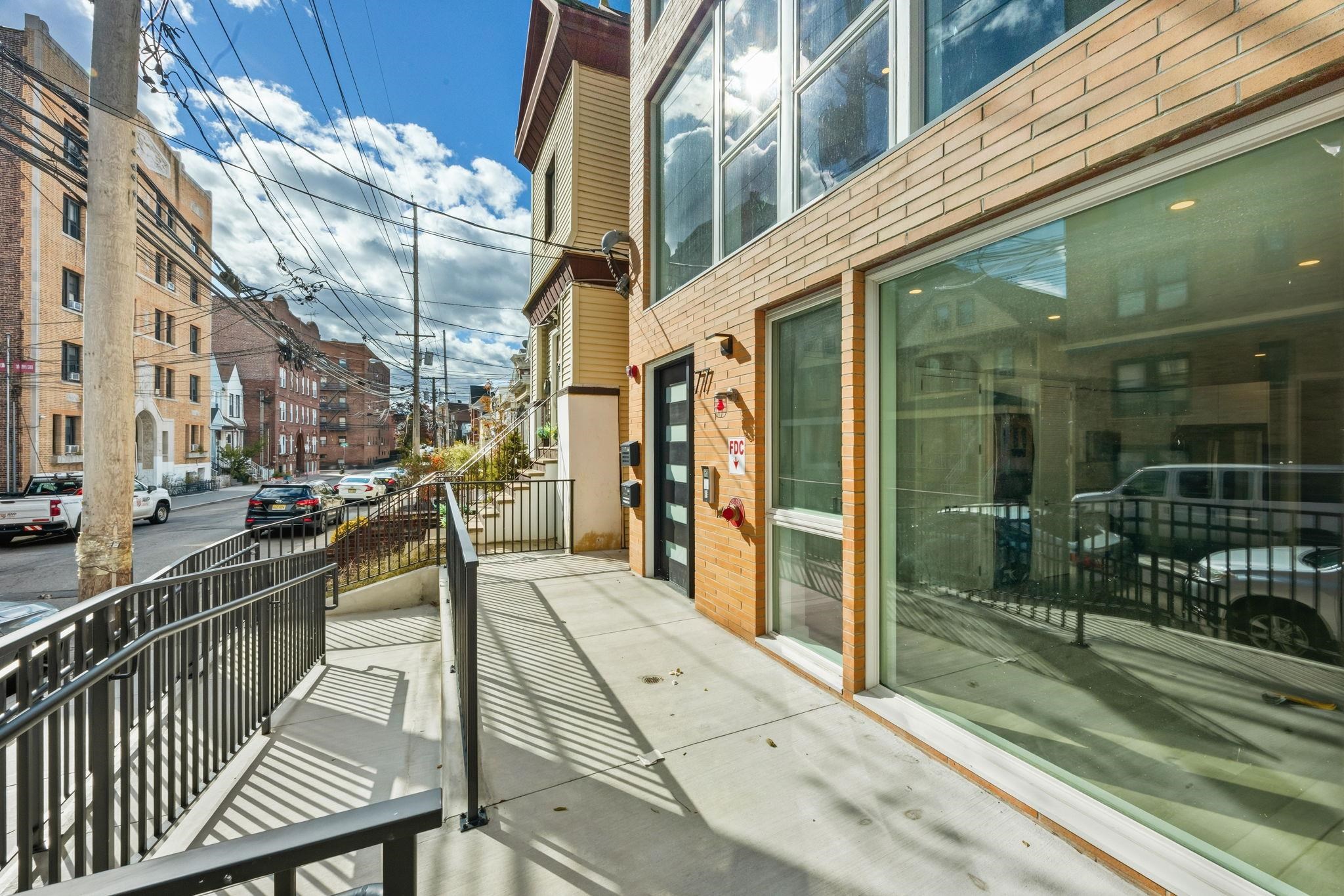 77 Van Reypen Street, Unit 3 Jersey City, NJ 07306 - Photo 15 of 23 a view of a balcony with a potted plant
