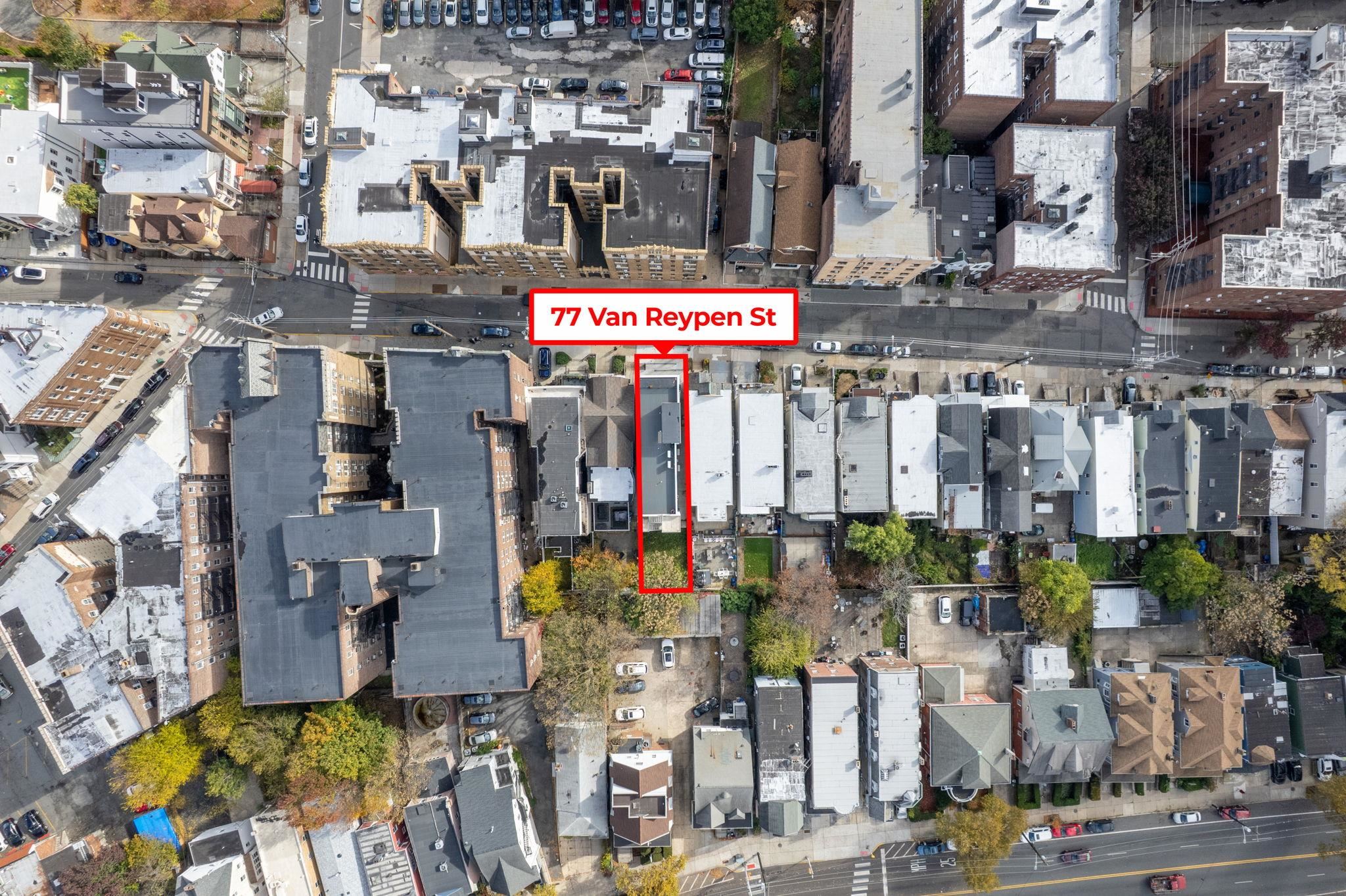 77 Van Reypen Street, Unit 3 Jersey City, NJ 07306 - Photo 17 of 23 a view of city with the shops and fruits market