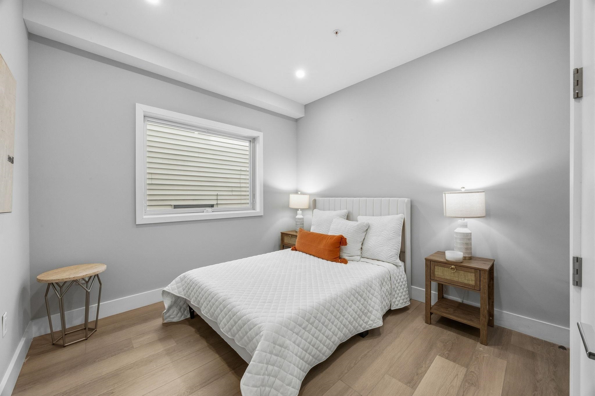 77 Van Reypen Street, Unit 3 Jersey City, NJ 07306 - Photo 4 of 23 a bedroom with a bed and a table in it