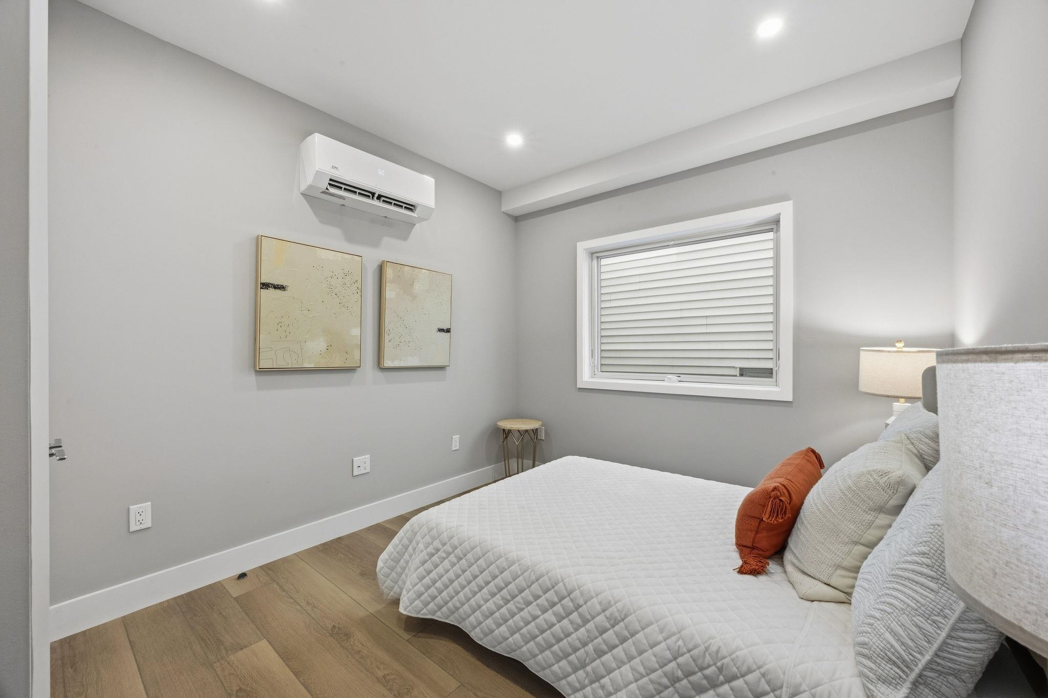 77 Van Reypen Street, Unit 3 Jersey City, NJ 07306 - Photo 5 of 23 a bedroom with a bed and a window