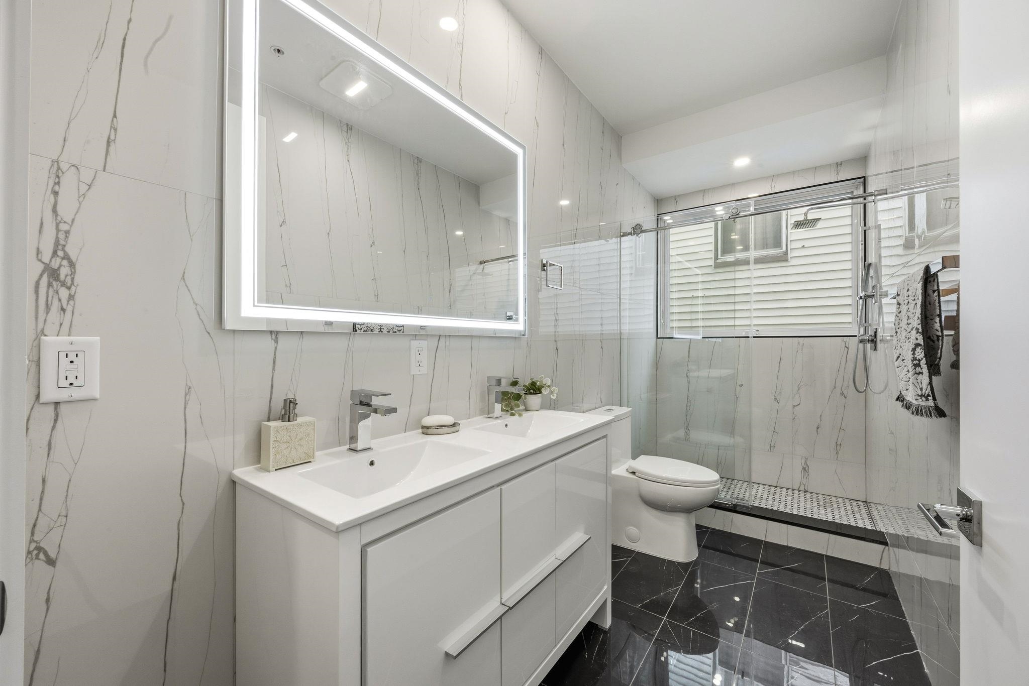 77 Van Reypen Street, Unit 3 Jersey City, NJ 07306 - Photo 8 of 23 a bathroom with a sink toilet and shower