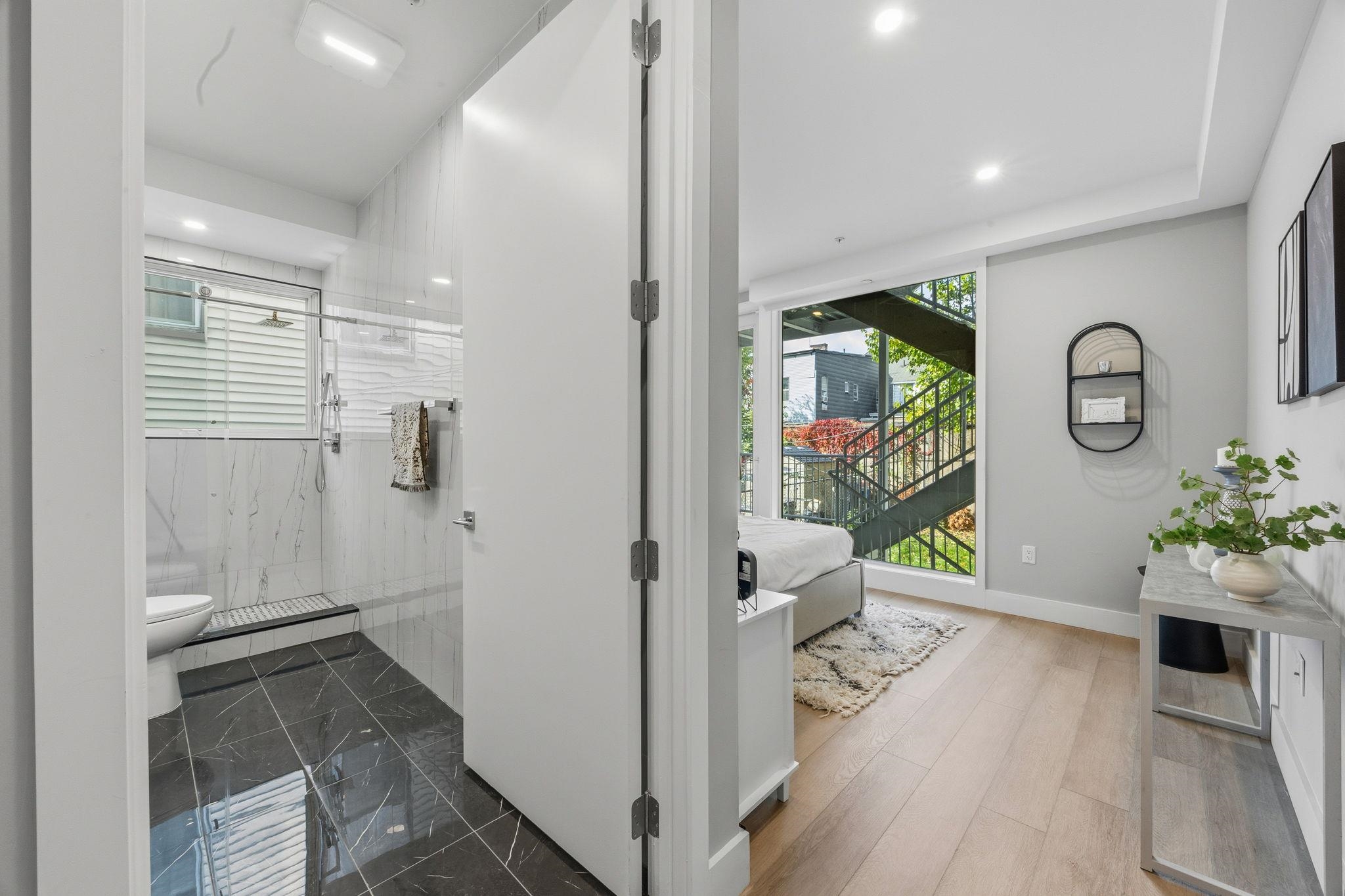 77 Van Reypen Street, Unit 3 Jersey City, NJ 07306 - Photo 9 of 23 a view of hallway with livingroom and wooden floor