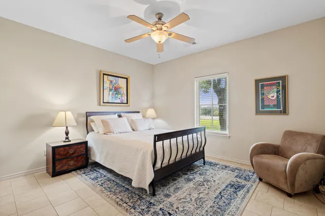 a bedroom with furniture and a window