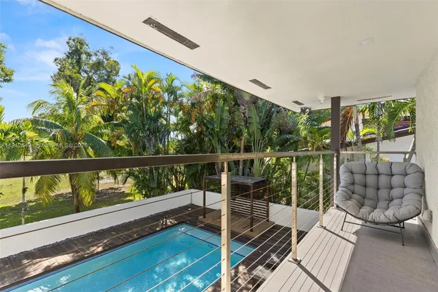 a bedroom with a bed and a chair