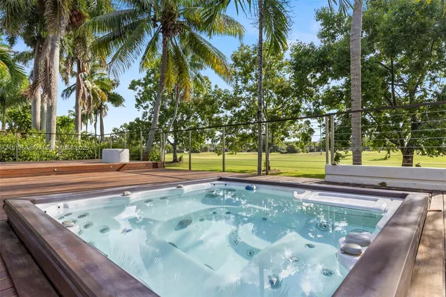 a view of a swimming pool with chairs