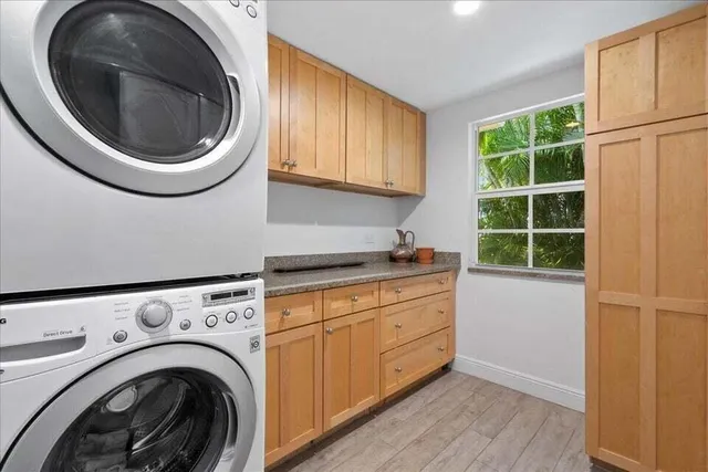 a kitchen with a sink and a washer dryer