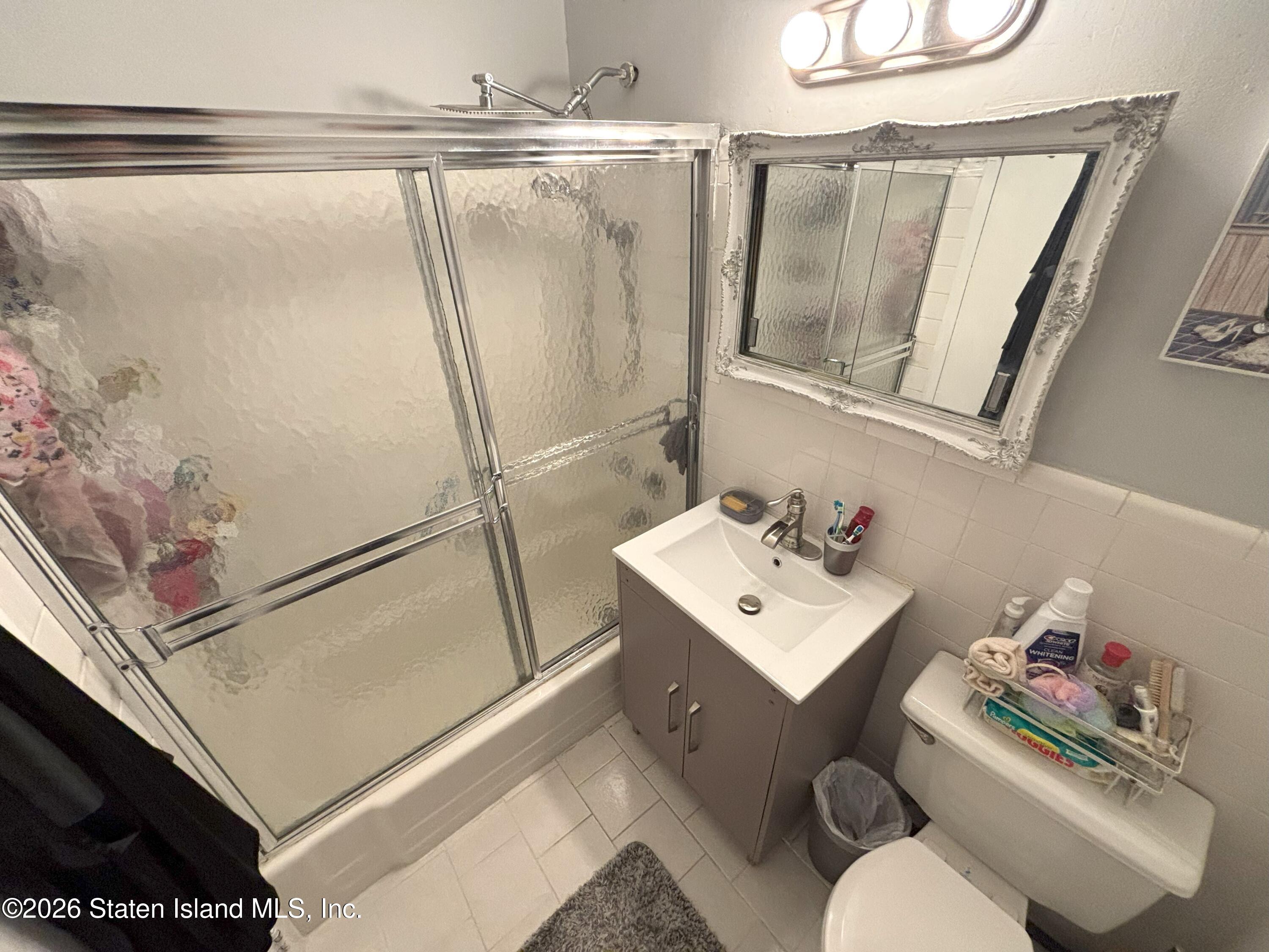 2483 West 16th Street, Unit 15F Brooklyn, NY 11214 - Photo 16 of 25 a bathroom with a sink toilet and shower