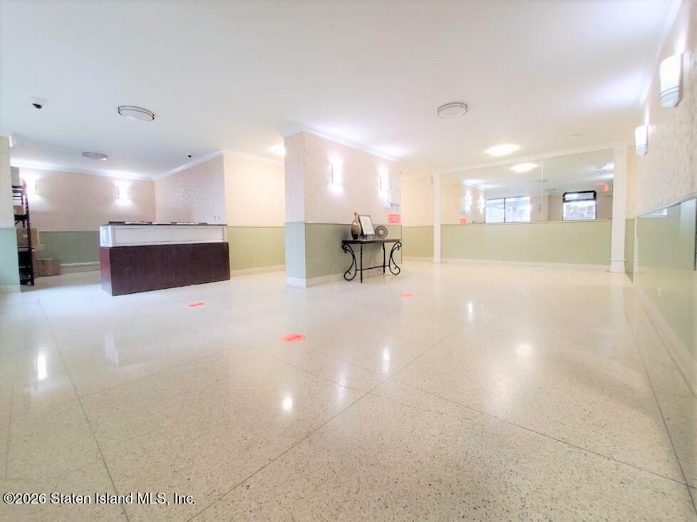 2483 West 16th Street, Unit 15F Brooklyn, NY 11214 - Photo 2 of 25 a lobby with furniture and a table