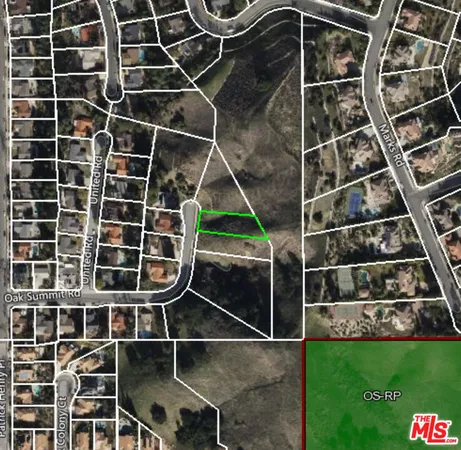 a backyard of a house with barbeque oven and a table