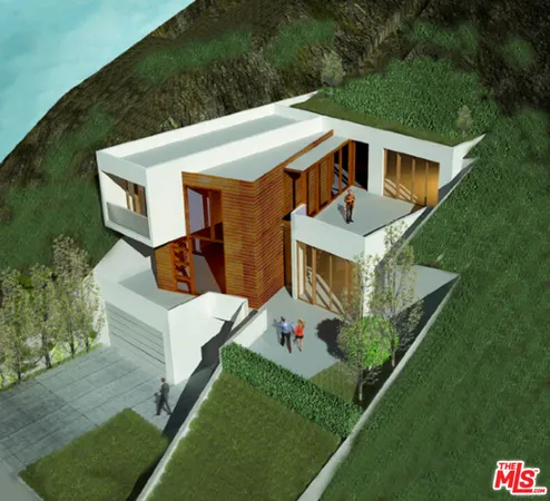 aerial view of a house with a yard