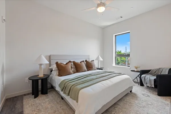 a bedroom with bed and a window