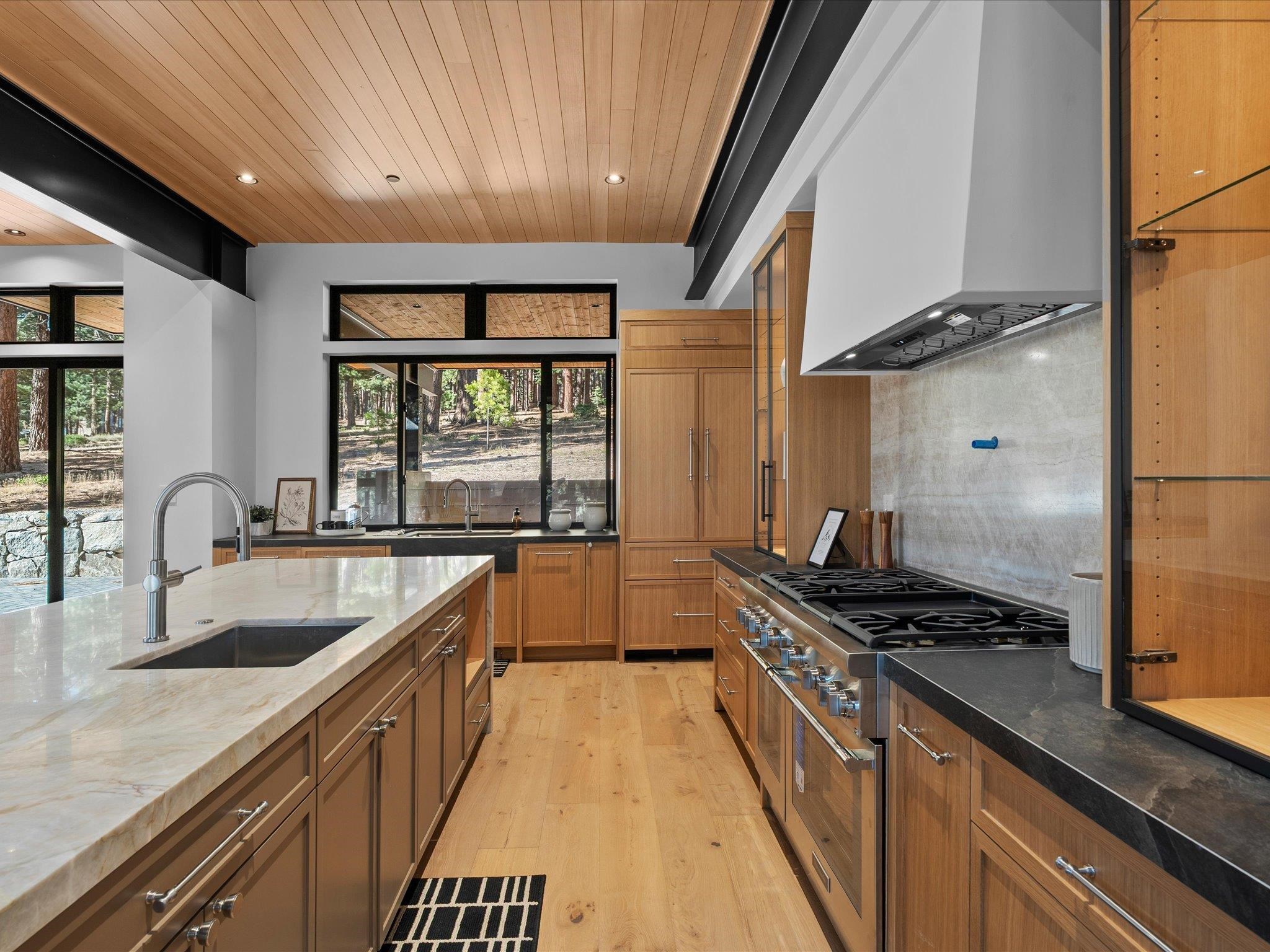 11630 Bottcher Loop Truckee, CA 96161 - Photo 13 of 28 a kitchen with stainless steel appliances granite countertop a sink stove and refrigerator
