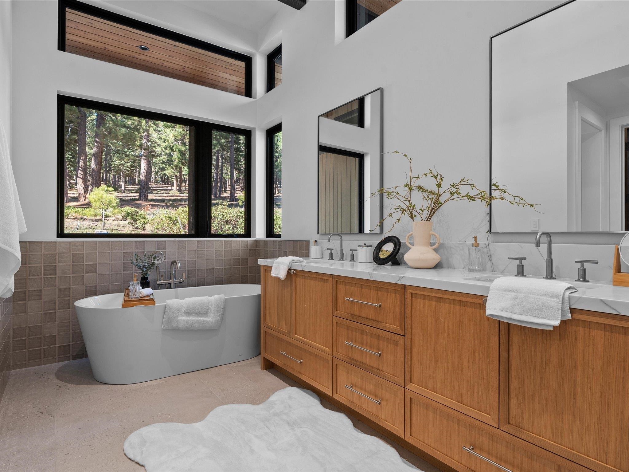 11630 Bottcher Loop Truckee, CA 96161 - Photo 19 of 28 a bathroom with a tub sink and mirror