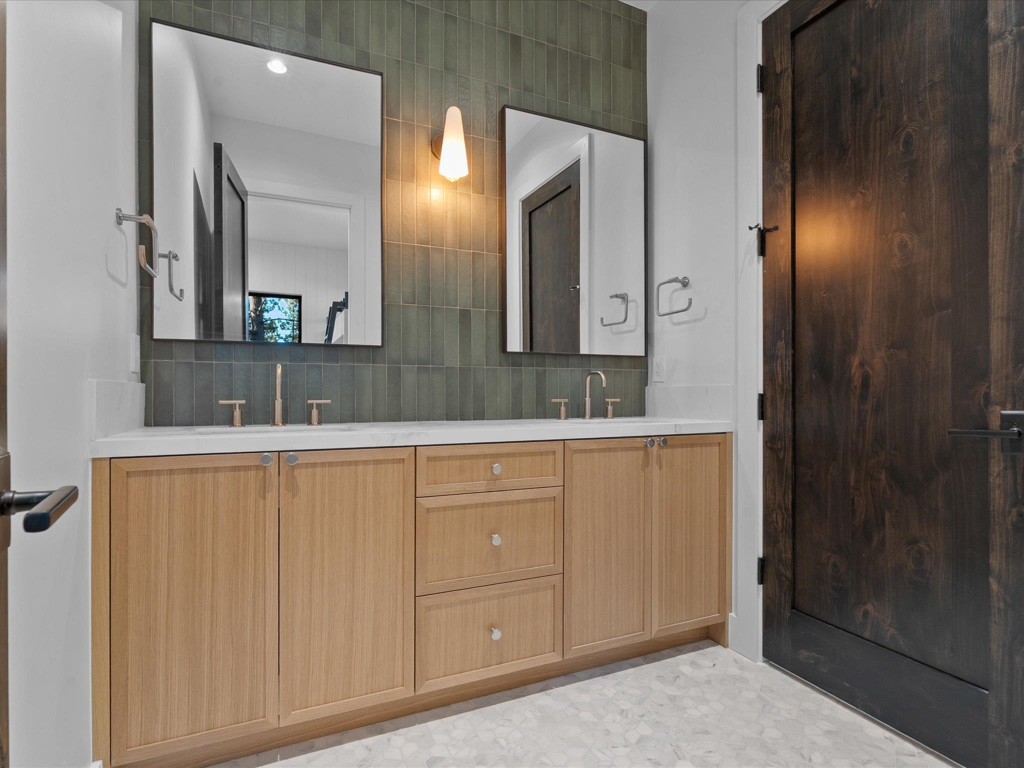 11630 Bottcher Loop Truckee, CA 96161 - Photo 26 of 28 a bathroom with a granite countertop sink and a mirror