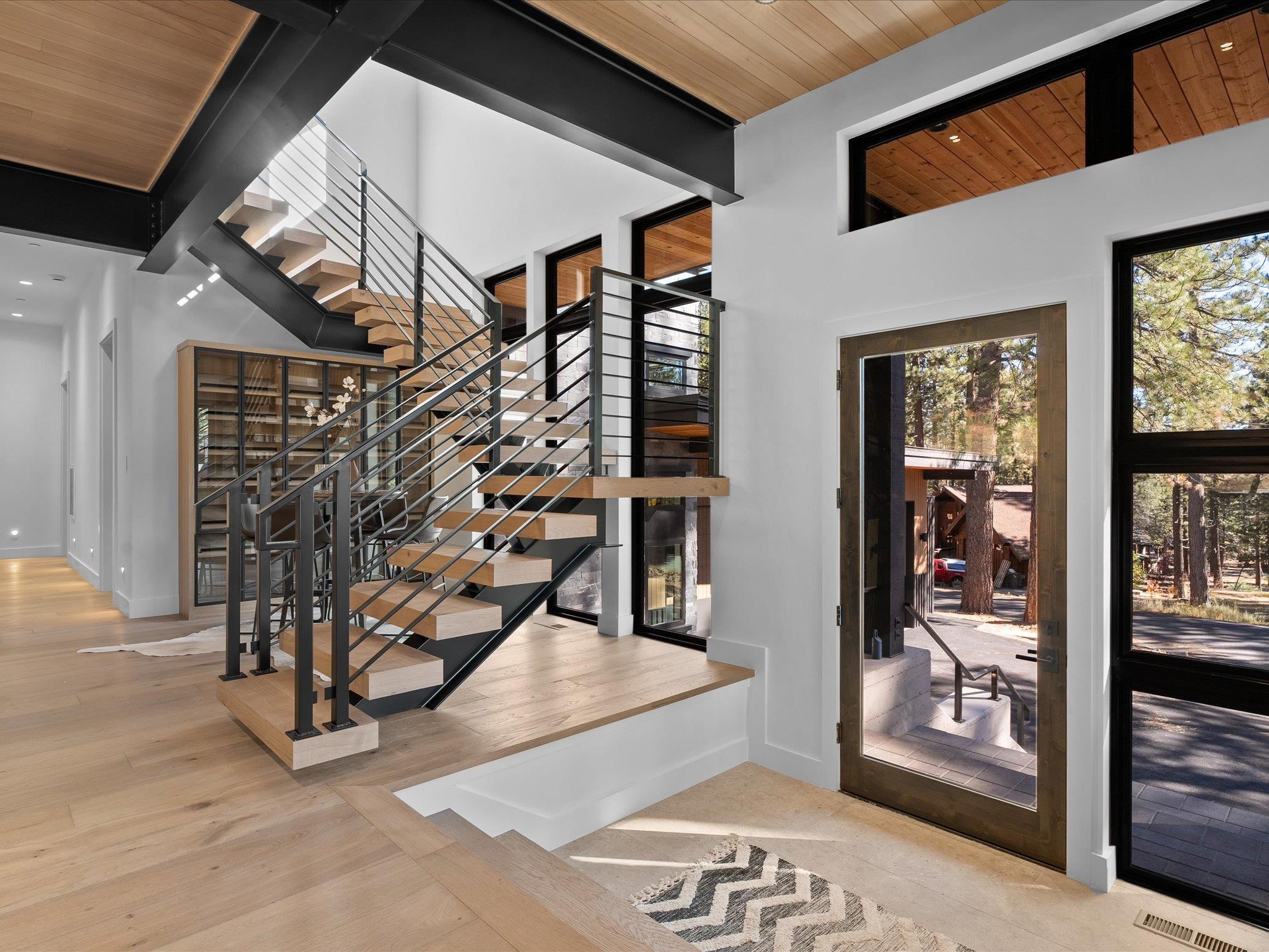 11630 Bottcher Loop Truckee, CA 96161 - Photo 3 of 28 a view of entryway with a hallway and wooden floor